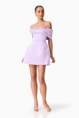 Brunette model wearing the Hope Off the Shoulder Mini Dress in Purple posed shot 
