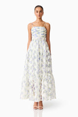 Brunette model wearing Cleo A-line Gown in White & Blue Floral front shot