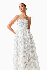 Brunette model wearing Cleo A-line Gown in White & Blue Floral close up shot