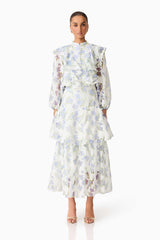 Brunette model wearing the Cleo Top & Skirt Set in White & Blue Floral front shot