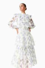 Brunette model wearing the Cleo Top & Skirt Set in White & Blue Floral close up shot