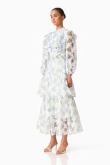 Brunette model wearing the Cleo Top & Skirt Set in White & Blue Floral side shot