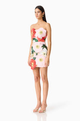 Brunette model wearing the Solara Strapless Mini Dress in Pink Floral side shot 