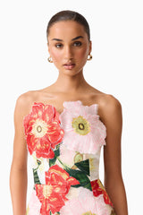 Brunette model wearing the Solara Strapless Midi Dress in Pink Floral close up shot 
