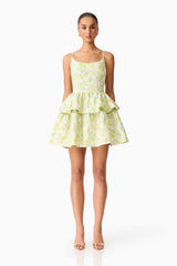 Brunette model wearing the Posey Jacquard Mini Dress in Green Floral front shot