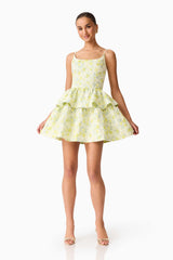 Brunette model wearing the Posey Jacquard Mini Dress in Green Floral posed shot