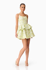 Brunette model wearing the Posey Jacquard Mini Dress in Green Floral posed  shot