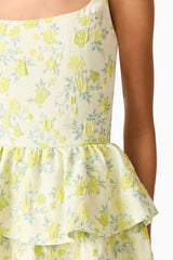 Brunette model wearing the Posey Jacquard Mini Dress in Green Floral detail shot