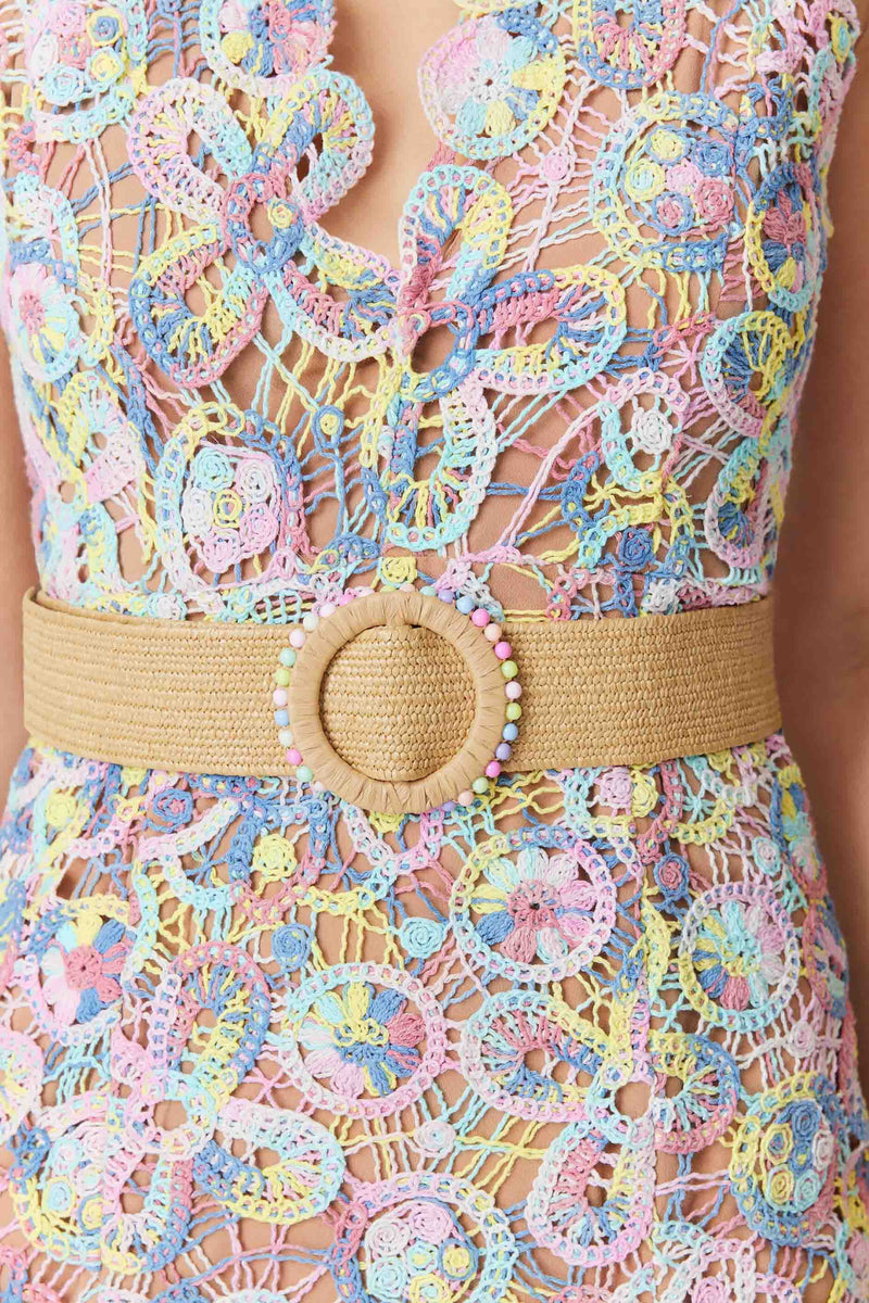 Brunette model wearing Rue Crochet Midi Dress in Purple detail shot