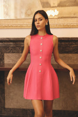 Brunette model wearing the Opline Tuplip Mini Dress in Hot Pink campaign shot 