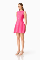 Brunette model wearing the Opline Tuplip Mini Dress in Hot Pink side shot 