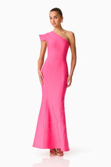 Brunette model wearing the Opline One Shoulder Gown in Hot Pink posed shot