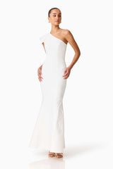 Brunette model wearing the Opline One Shoulder Gown in White posed shot 