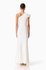 Brunette model wearing the Opline One Shoulder Gown in White back shot 