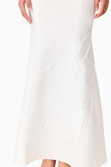 Brunette model wearing the Opline One Shoulder Gown in White detail shot 