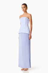Brunette model wearing the Lacy strapless gown in powder blue side shot