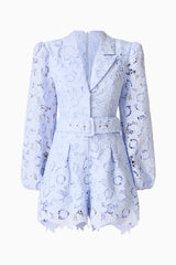 Brunette model wearing the Lacy Long Sleeve Playsuit in Powder Blue ghost shot 