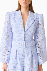 Brunette model wearing the Lacy Long Sleeve Playsuit in Powder Blue detail shot 