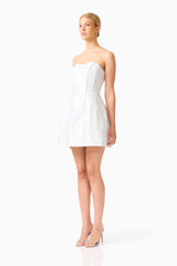 Blonde model wearing the Floralie Strapless Mini Dress in Silver side shot