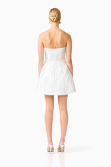 Blonde model wearing the Floralie Strapless Mini Dress in Silver back shot