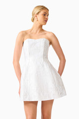 Blonde model wearing the Floralie Strapless Mini Dress in Silver close up looking away shot