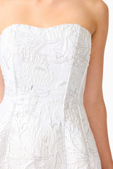 Blonde model wearing the Floralie Strapless Mini Dress in Silver detail shot