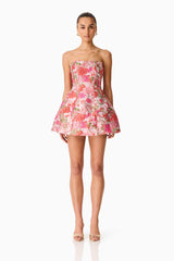 Brunette model wearing the Floralie Strapless Mini Dress in Pink Floral front shot 
