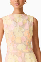 Brunette model wearing the Zaria Sleevless Gown in Yellow Floral detail shot