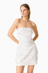 Brunette model wearing the Lucine Strapless Mini Dress in White close up shot