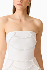 Brunette model wearing the Lucine Strapless Mini Dress in White detail shot