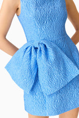 Brunette model wearing the Briallen Jacquard Mini Dress in Blue Detail Shot