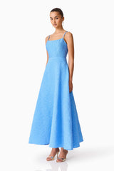 Brunette model wearing the Briallen Jacquard Gown in Blue Side Shot