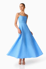 Brunette model wearing the Briallen Jacquard Gown in Blue Posed Shot