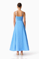 Brunette model wearing the Briallen Jacquard Gown in Blue Back Shot