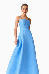 Brunette model wearing the Briallen Jacquard Gown in Blue Close Up Shot