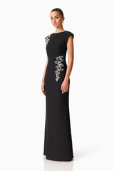 Brunette model wearing the Veda Embellished Gown in Black Side Shot