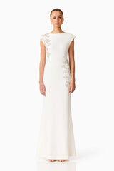 Brunette model wearing the Veda Embellished Gown in White Front Shot