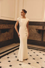 Brunette model wearing the Veda Embellished Gown in White Campaign Shot