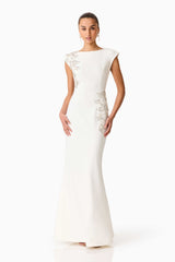 Brunette model wearing the Veda Embellished Gown in White Posed Shot