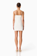 Brunette model wearing the Veda Embellished Mini Dress in White Back Shot