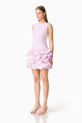 Brunette model wearing the Saphine Ruffle Mini Dress in Pink Side Shot