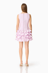 Brunette model wearing the Saphine Ruffle Mini Dress in Pink Back Shot