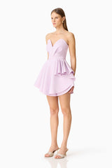 Brunette model wearing the Saphine Frill Mini Dress in Pink Side Shot