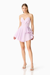 Brunette model wearing the Saphine Frill Mini Dress in Pink Posed Shot