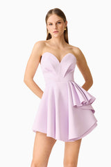 Brunette model wearing the Saphine Frill Mini Dress in Pink Close Up Shot