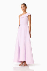 Brunette model wearing the Saphine One Shoulder Gown in Pink Side Shot