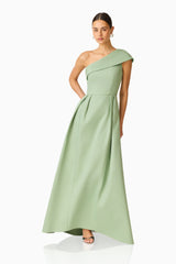 Saphine One Shoulder Gown in Sage Green with an asymmetric neckline posed shot