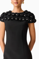 Brunette model wearing the Dali Floral Applique Mini Dress in Black Detail Shot