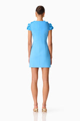Brunette model wearing the Dali Floral Applique Mini Dress in Blue Back Shot