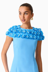 Brunette model wearing the Dali Floral Applique Mini Dress in Blue Detail Shot